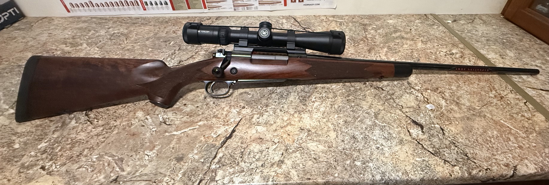 New 3006 Winchester Mod 70 Super Grade with scope.